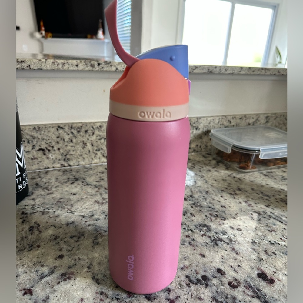 Owala 40 oz free sip including straw and removable stopper.